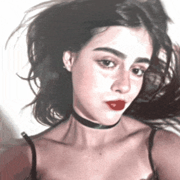 a woman with a choker around her neck has red lipstick on her lips