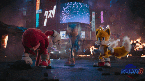 sonic the hedgehog knuckles and tails are standing next to each other in a scene from the movie sonic 3