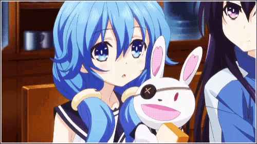 a girl with blue hair is holding a stuffed bunny with a patch on its eye