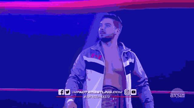 a man in a wrestling ring with the website impactwrestling.com on the bottom
