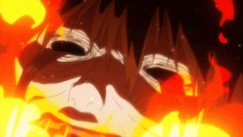 a close up of a person 's face with fire coming out of it .