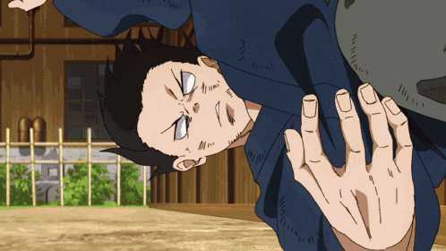 a man in a blue shirt is upside down in a cartoon
