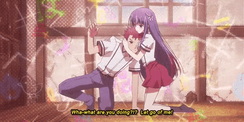 a girl with purple hair is hugging a boy with red hair and says what are you doing