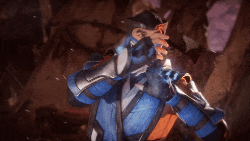 a video game character in a blue and orange outfit covering his face