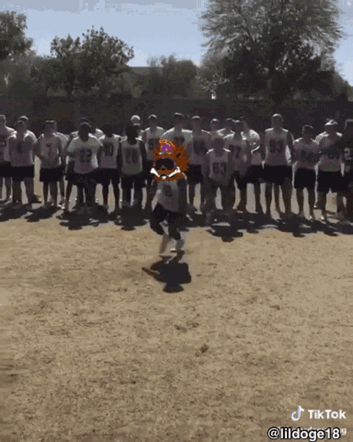 a group of football players are standing on a field and one has the number 23 on his shirt
