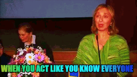 a woman stands at a podium with the words when you act like you know everyone