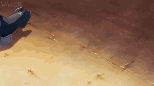 a blurry picture of a person standing on a sandy surface with the word bilibili on the bottom