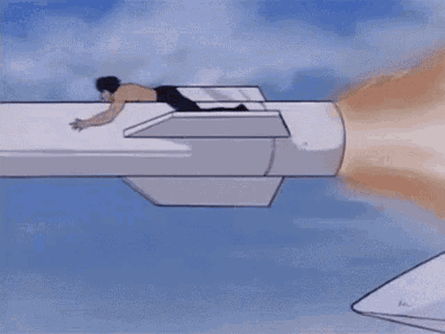 a cartoon man with a red bandana on his head is laying on a white surface .