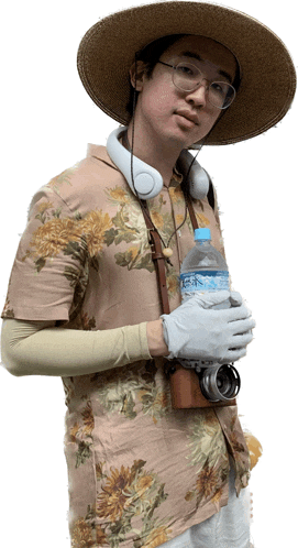 a man wearing a hat and headphones holds a bottle of aquafina water