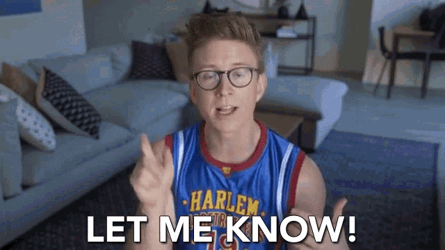 a man wearing glasses and a harlem basketball jersey says let me know .