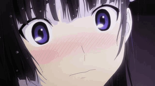 a close up of a girl 's face with a purple eye