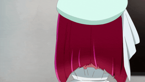 a girl with red hair has a white hat on her head