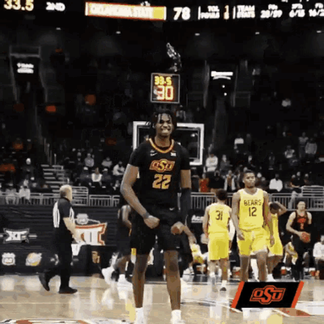 a basketball player with the number 22 on his shirt is dancing on the court