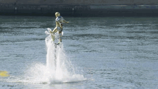 a man is flying through the air while riding a jet ski