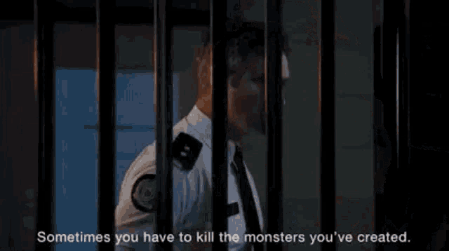 a police officer is standing behind bars in a jail cell with a quote .