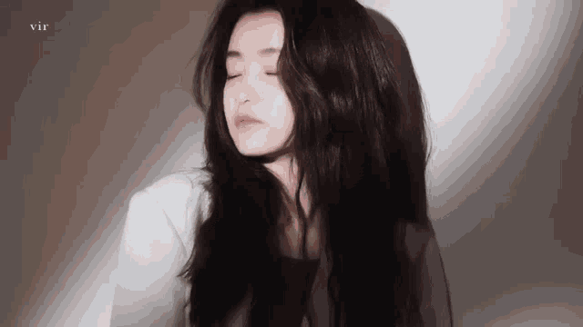 a close up of a woman with her eyes closed