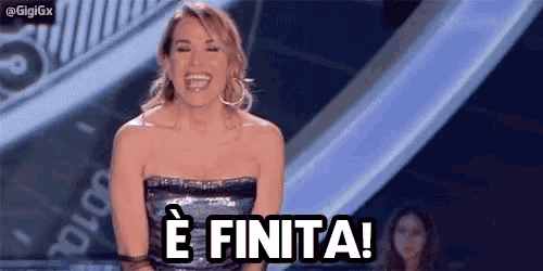 a woman in a strapless dress is laughing and says e finita