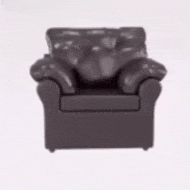 a brown leather chair is sitting on a white surface