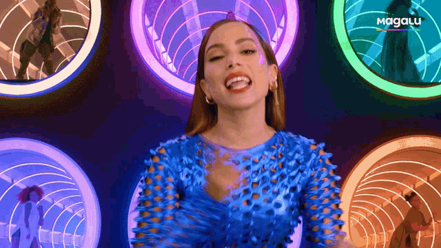 a woman in a blue dress is surrounded by colorful lights and the word magalu is on the bottom left