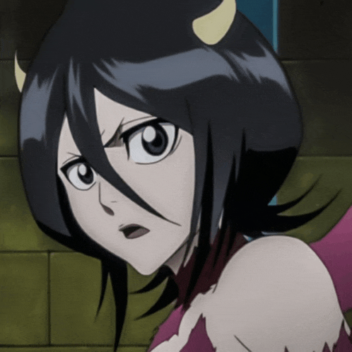 a girl with horns on her head is looking at the camera