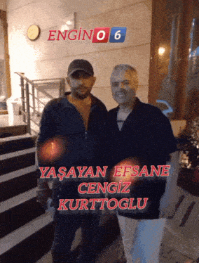 two men standing next to each other with the words yasayan efsane cengiz kurttoglu on the bottom