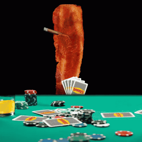a stack of denny 's cards on a table