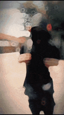a blurry picture of a person with a number 8 on their belt