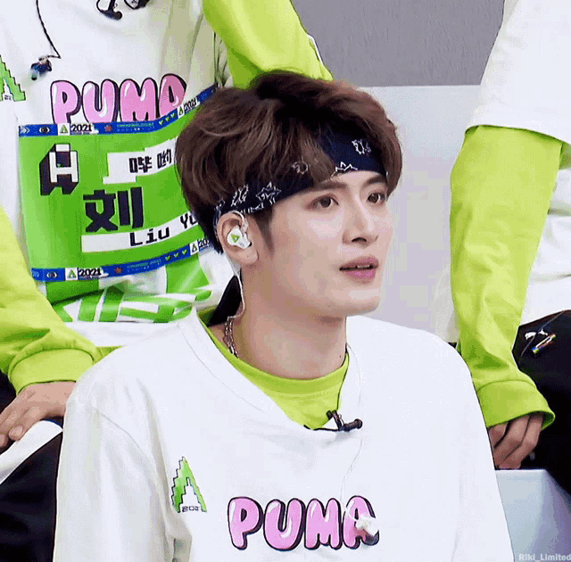 a person wearing a shirt that says puma