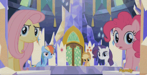 a group of ponies are standing in front of a castle with the word family on the bottom