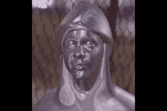 a statue of a man with a helmet on his head .