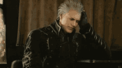a man with white hair is sitting at a table