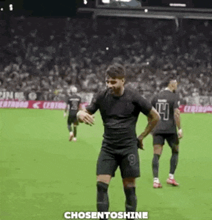 a soccer player is dancing on the field during a soccer game .