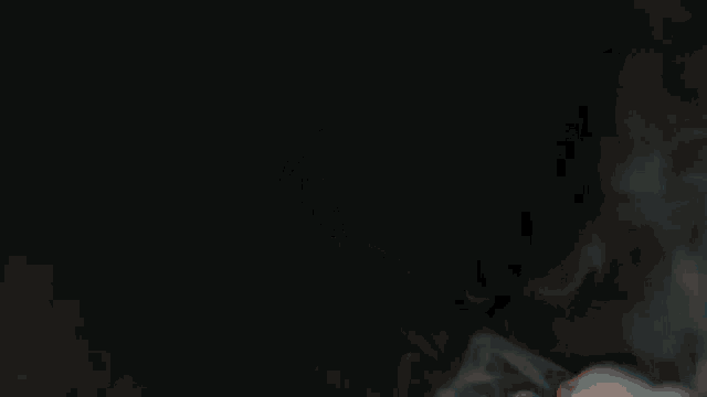 a black background with red and blue smoke coming out of the bottom