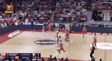 a basketball game is being played on a court with a bwin logo
