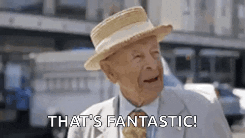 an elderly man wearing a straw hat and a suit says `` that 's fantastic '' .