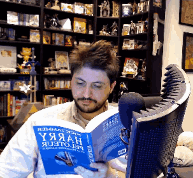 a man is reading a book called y.y.a.a.h.