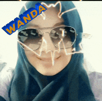 a woman wearing sunglasses and a hijab with the name wanda on her face