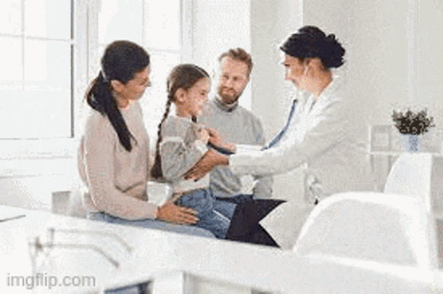 a doctor is listening to a little girl 's heartbeat with a stethoscope while her parents watch .