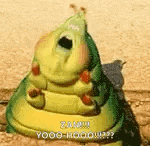 a cartoon worm with its mouth open is sitting on a rock .