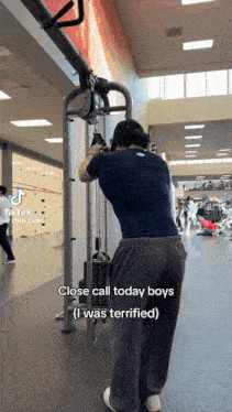 a man is using a machine in a gym and says " close call today boys "