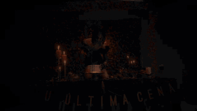 a woman in a black dress is cutting a cake