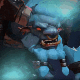 a blue monster with red eyes and teeth is in a dark room