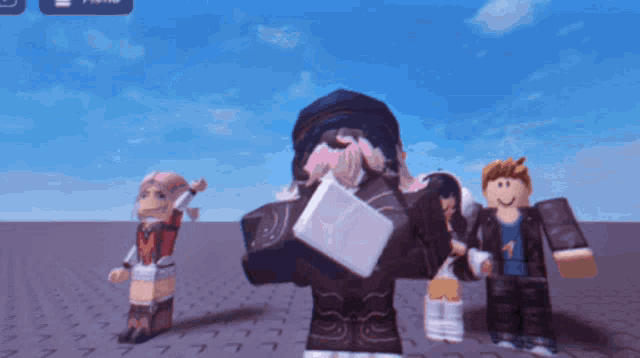a girl with pink hair is standing next to a boy and a girl in roblox