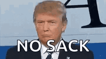 donald trump is wearing a suit and tie and has the words `` no sack '' on his face .