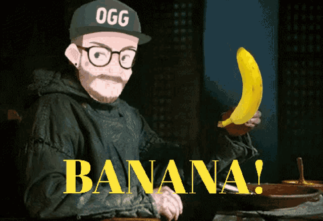 a man wearing a ogg hat holds a banana