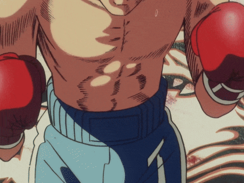 a man wearing boxing gloves has the number 1 on the bottom of his shorts