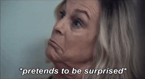an older woman is making a funny face and says `` pretends to be surprised '' .