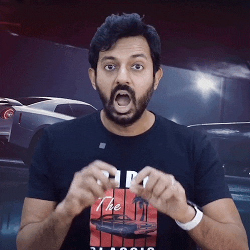 a man wearing a black t-shirt that says " the " on it