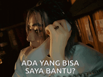 a woman talking on a phone with the words ada yang bisa saya bantu written below her
