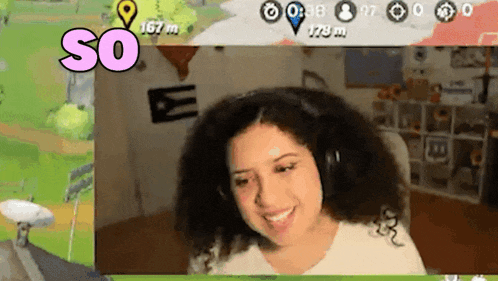 a woman wearing headphones is smiling while playing a video game